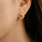 Petal marquise huggie earrings worn, floral crystal hoop earrings in gold vermeil, dainty bridal jewellery