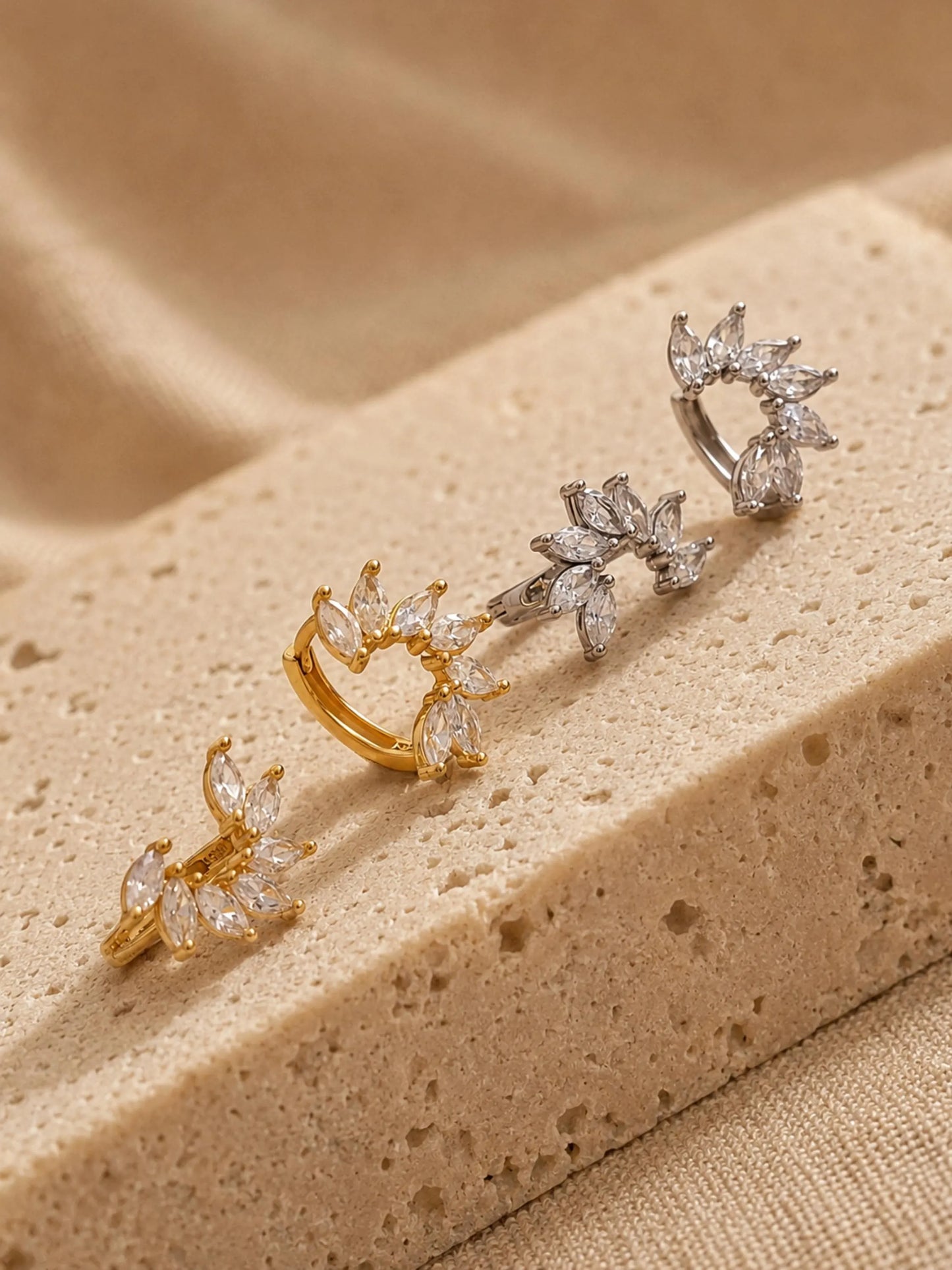 Set of dainty floral huggie hoop earrings crafted in gold plated sterling silver featuring flower shaped arrangement of a pile of marquise cubic zirconia stone, elegant and edgy jewellery