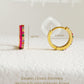 Pair of pink enamel huggie hoop earrings with multicolor cubic zirconia gemstones set in 18k gold plated sterling silver, displayed on a white background.
