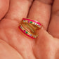 Pair of pink enamel huggie hoop earrings with multicolor cubic zirconia gemstones set in 18k gold plated sterling silver