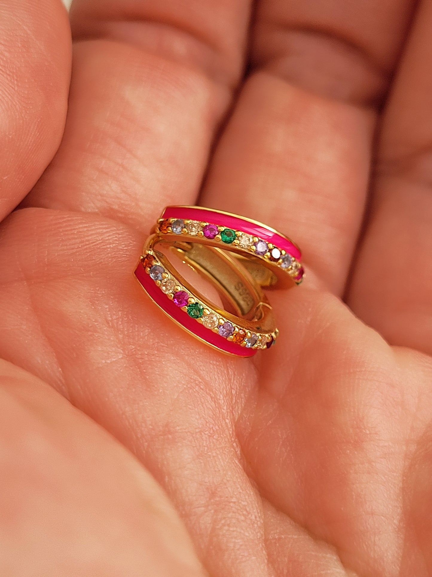 Pair of pink enamel huggie hoop earrings with multicolor cubic zirconia gemstones set in 18k gold plated sterling silver