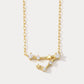 A gold-plated necklace featuring a delicate design with sparkling zircons, representing the Pisces zodiac sign.