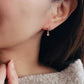 Elegant gold-plated huggie hoop earrings featuring purple flowers and delicate dangling charm, crafted in 18k gold plated sterling silver. Best valentines day gift for her.