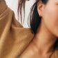 model wearing blue star huggie earrings in casual wear style, perfect gift for birthday