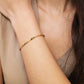 A minimalist gold bracelet with colorful tourmaline gemstone beads and gold plated beads, perfect for layering and stacking. Idea birthday gift for her.
