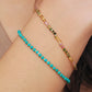 Close-up of a boho-chic beaded bracelet featuring natural tourmaline and gold plated beads. Perfect gift for her.