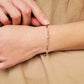 Close-up of a boho-chic beaded bracelet featuring natural tourmaline and gold plated beads. Perfect gift for her.