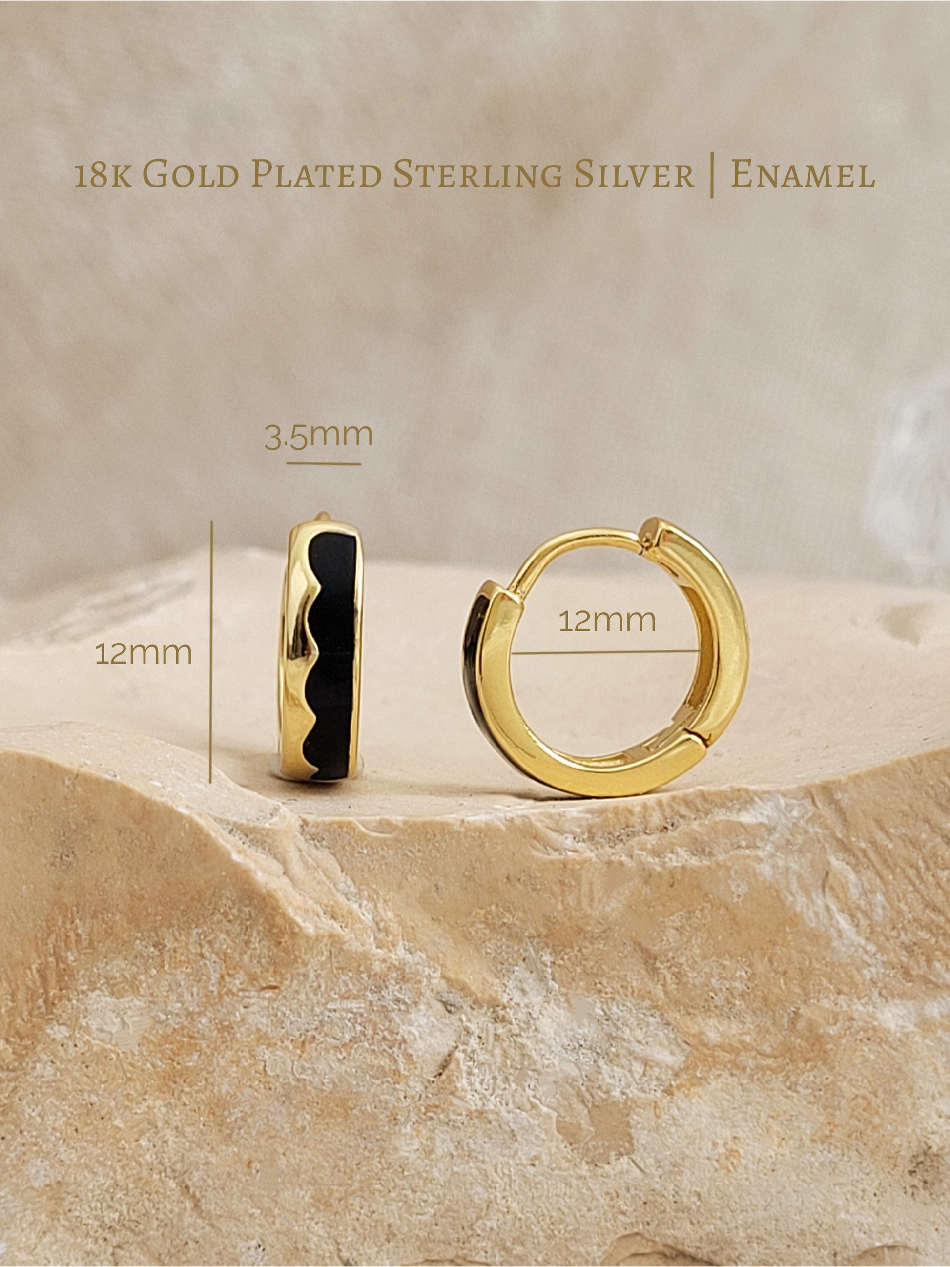 Gold-plated sterling silver hoop earrings with measurements on a beige stone background