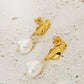 Elegant freshwater pearl dangle earrings in gold, highlighting a modern, minimalistic design. Perfect for wedding and anniversary.