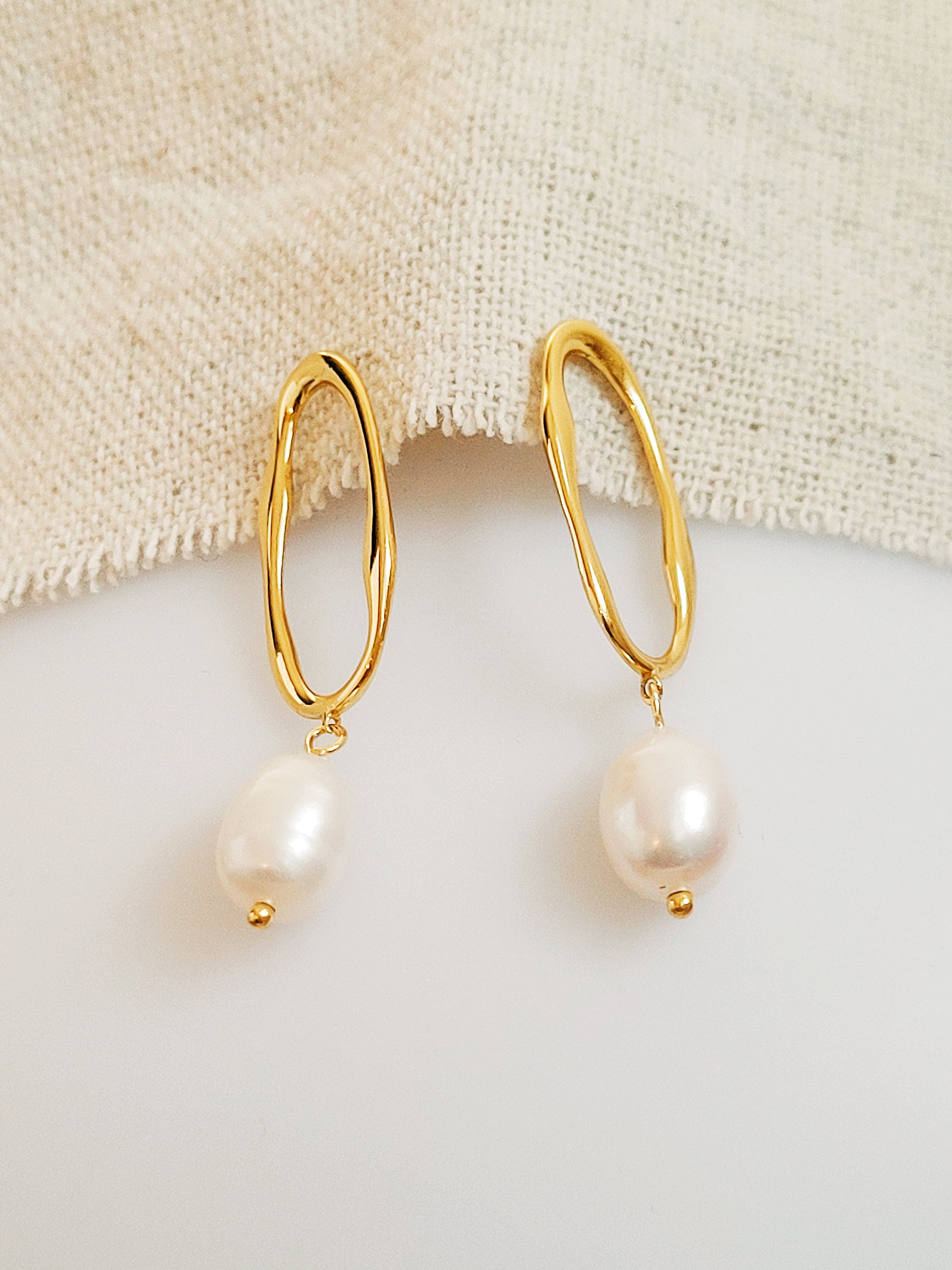 Gold-plated dangle earrings with natural freshwater pearls