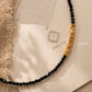 Detailed view of a handmade black spinel gemstone choker necklace with a 23mm section of faceted, organic 22k gold vermeil nugget beads over 925 sterling silver.