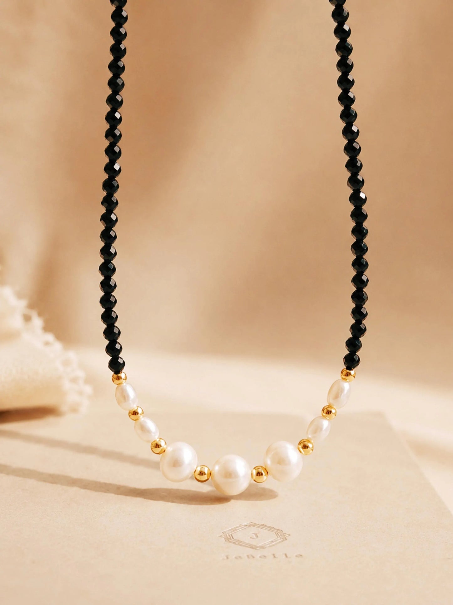 Black spinel pearl choker necklace with freshwater pearls and 18k gold plated sterling silver details, elegant handmade jewellery for weddings and gifting.