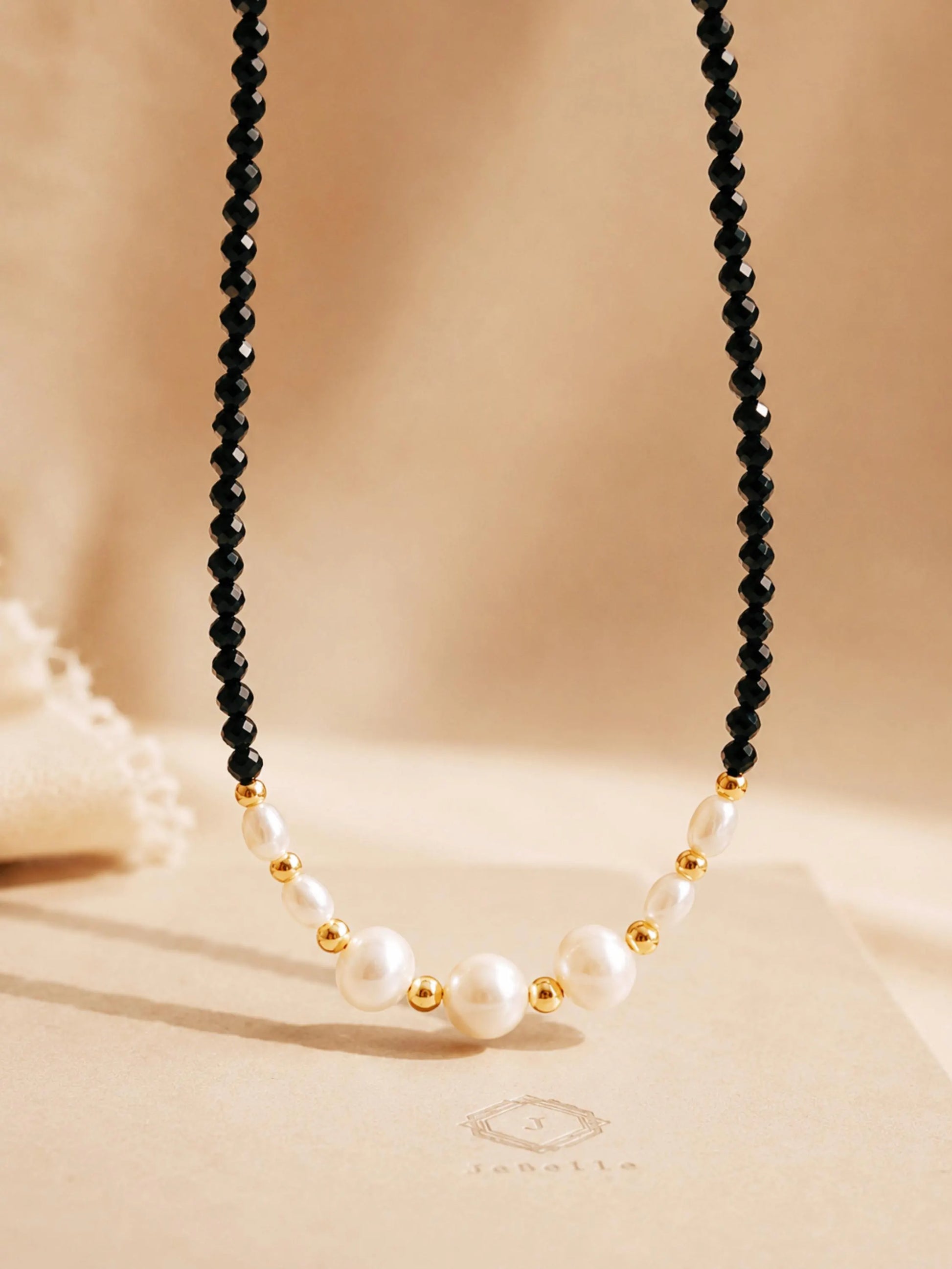 Black spinel pearl choker necklace with freshwater pearls and 18k gold plated sterling silver details, elegant handmade jewellery for weddings and gifting.