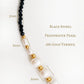 Necklace with black spinel, freshwater pearl, and 18k gold vermeil beads on a white background.
