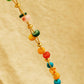 Close up of the colorful onyx gemstone beads and gold beads on a bracelet