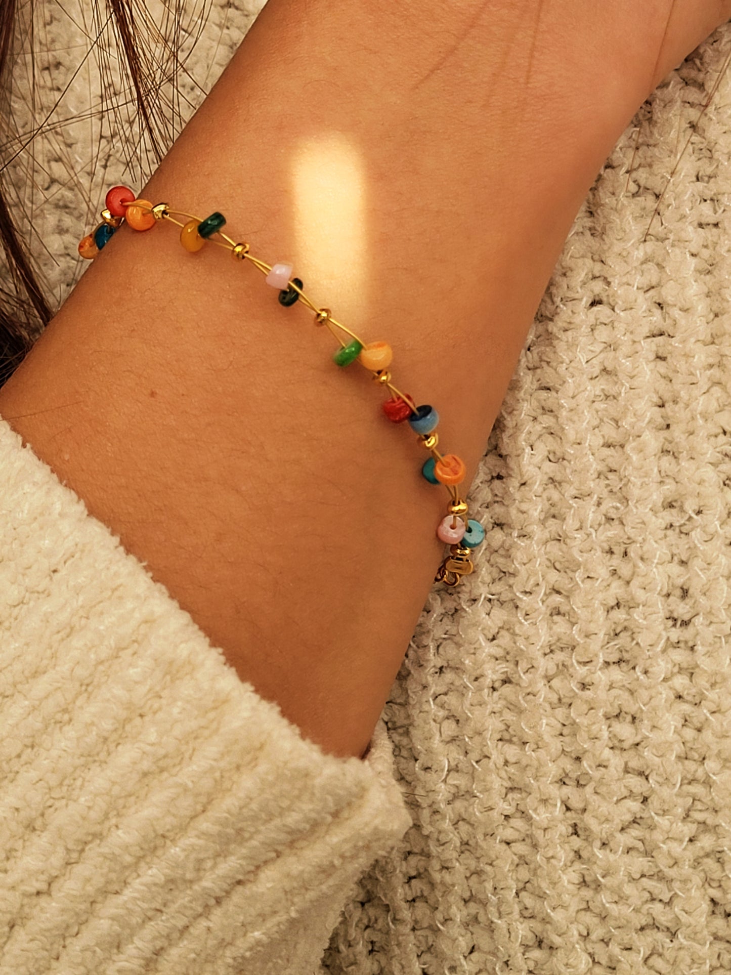 Colorful beaded gemstone bracelet on a girl's wrist, perfect chiristmas gift for her