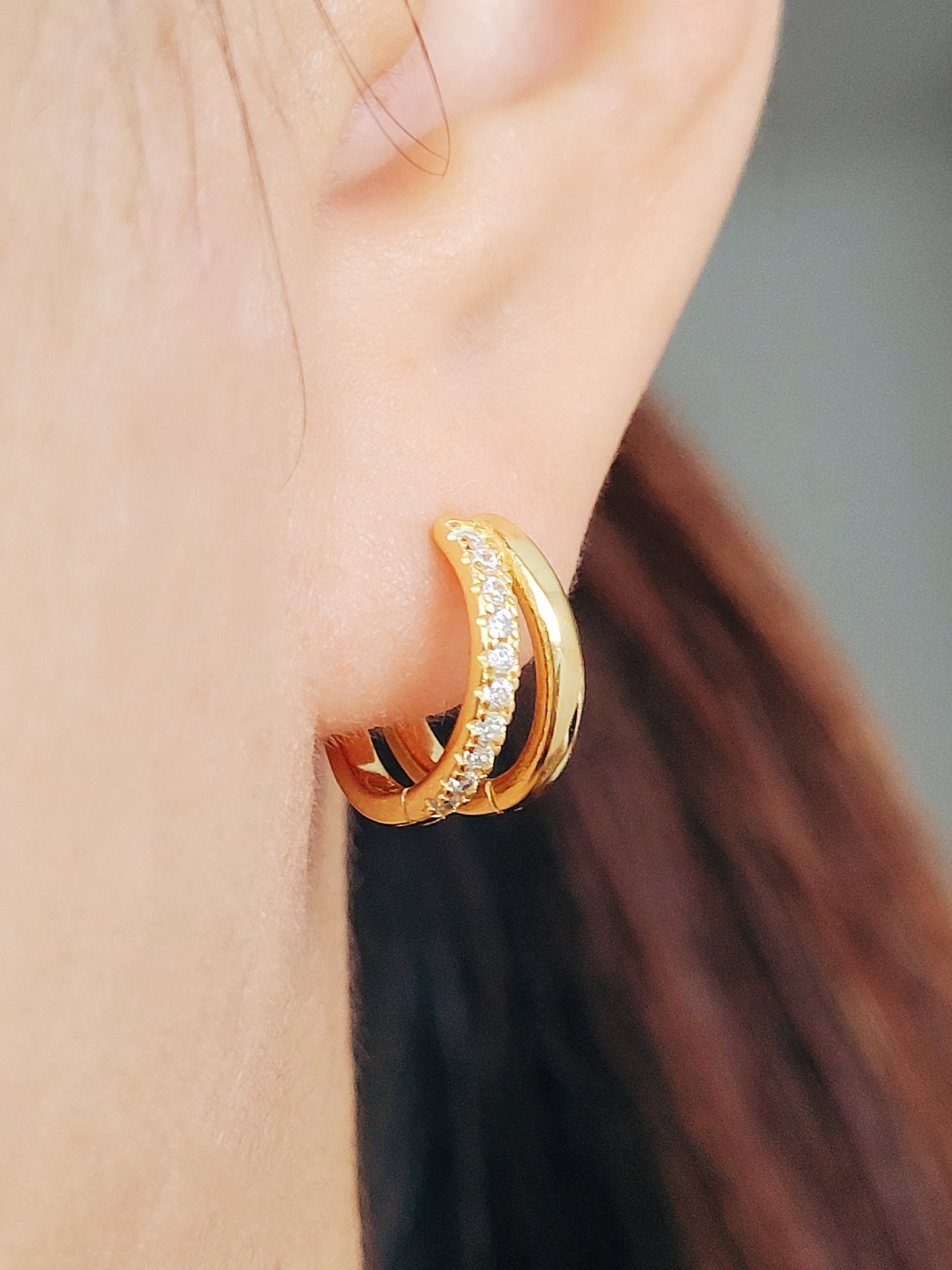 Chic double hoop earrings that catch the light beautifully, ideal for dressing up or down any look.