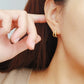 Trendy gold double hoop earrings featuring a modern design, great for enhancing your everyday style effortlessly.