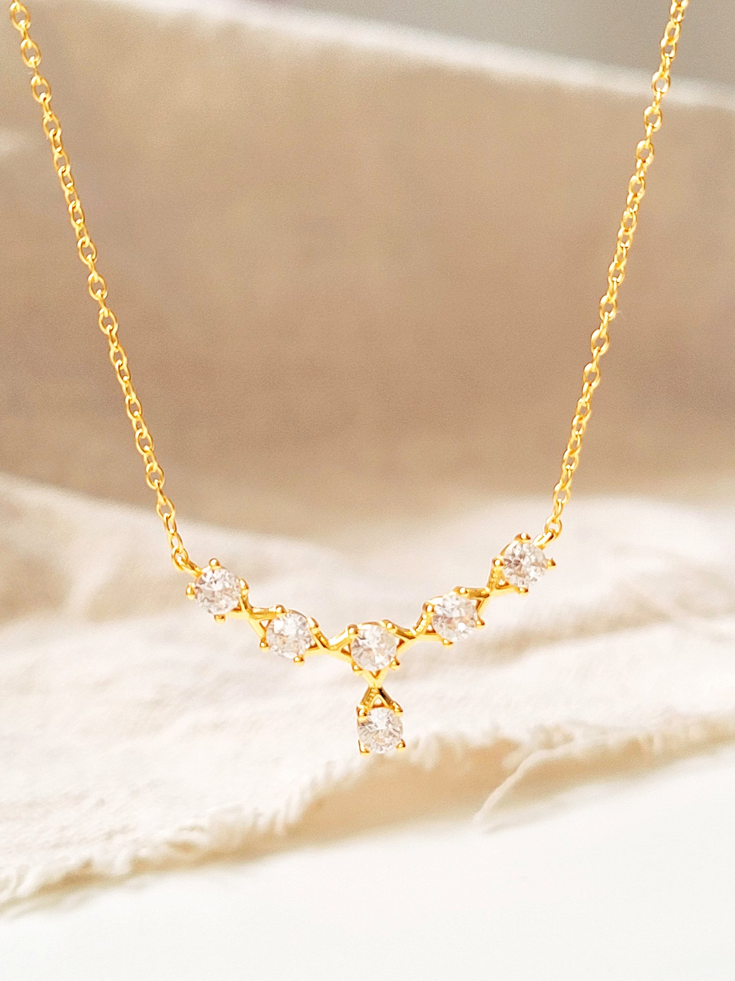 Minimalist 18k gold vermeil crown necklace with delicate crystals, ideal for weddings, anniversaries, and gifting.