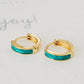 Elegant gold and turquoise green enamel huggie hoop earrings, featuring a chic design that adds flair to your everyday style.
