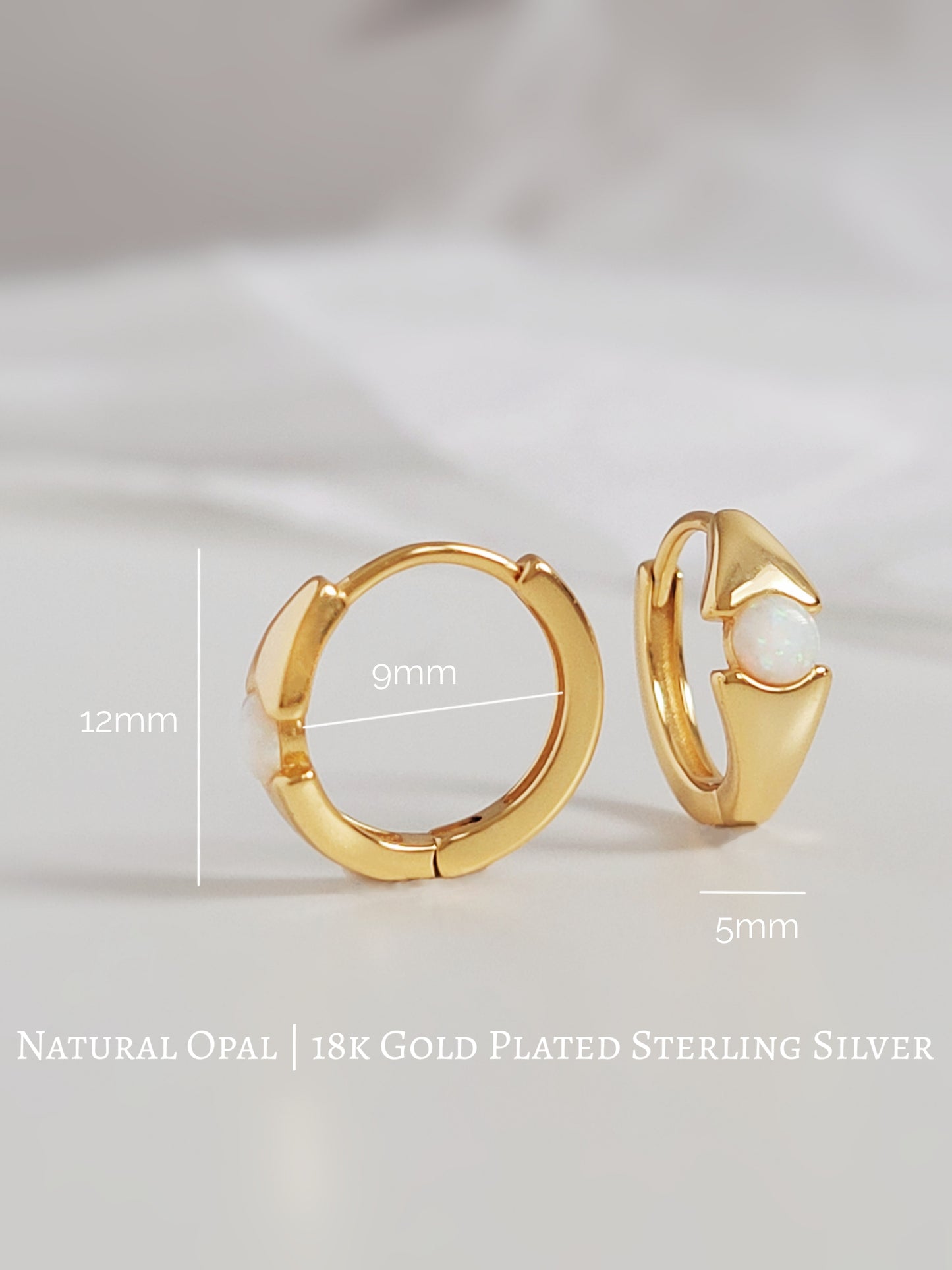 Small gold hoop earrings featuring an evil eye design with a shimmering opal stone centerpiece, perfect for everyday wear. 