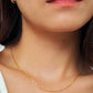 Close-up of a dainty gold necklace with square station beads, reflecting light with subtle shimmer, ideal for daily wear. Crafted in gold plated sterling silver, perfect jewellery for everyday wear. A thoughtful gift for birthdays, anniversaries or any occasions.
