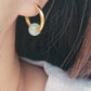 Stylish gold jade hoop earrings featuring a vibrant pale green color, ideal for enhancing both casual and formal looks.