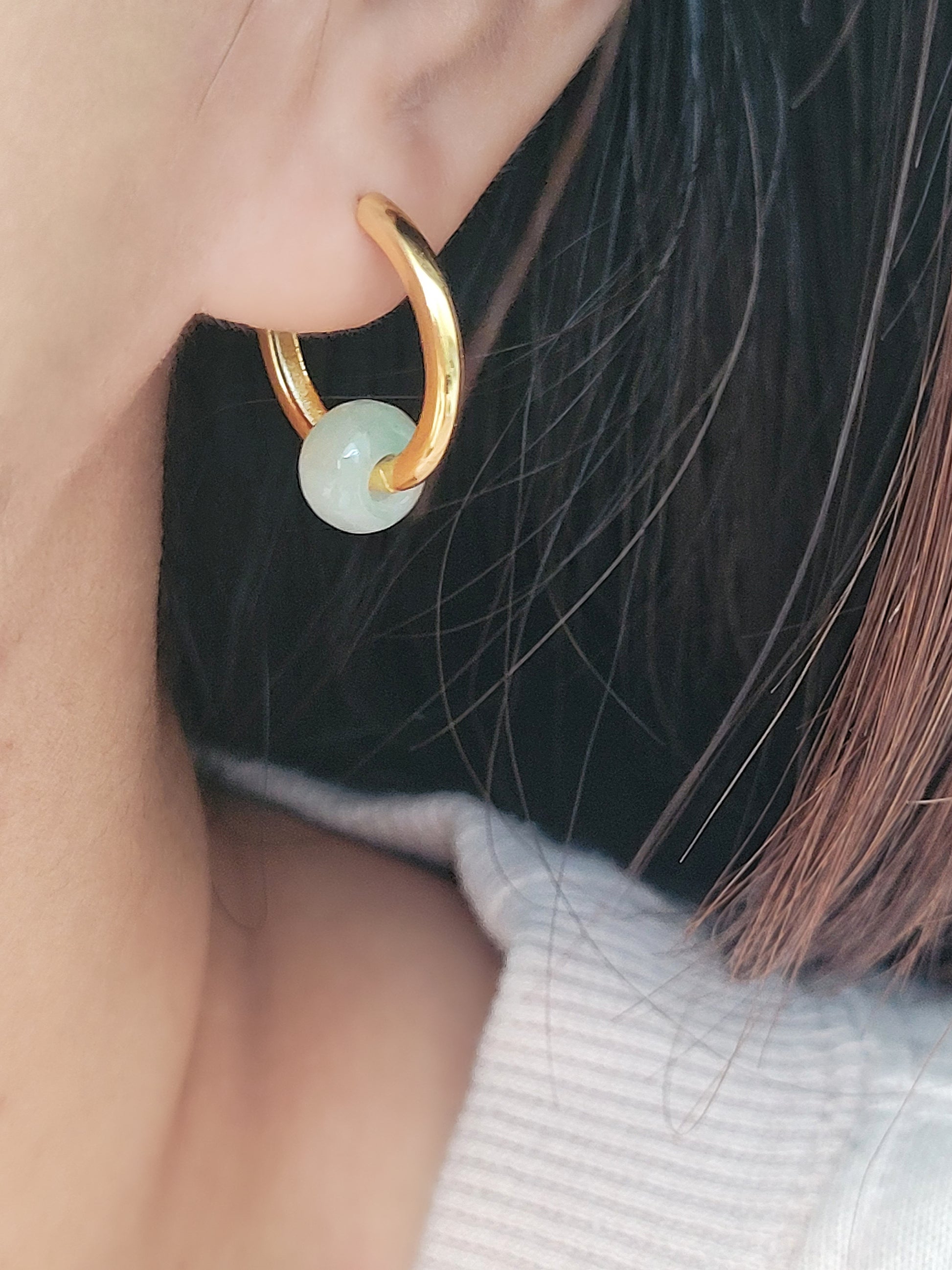 Stylish gold jade hoop earrings featuring a vibrant pale green color, ideal for enhancing both casual and formal looks.