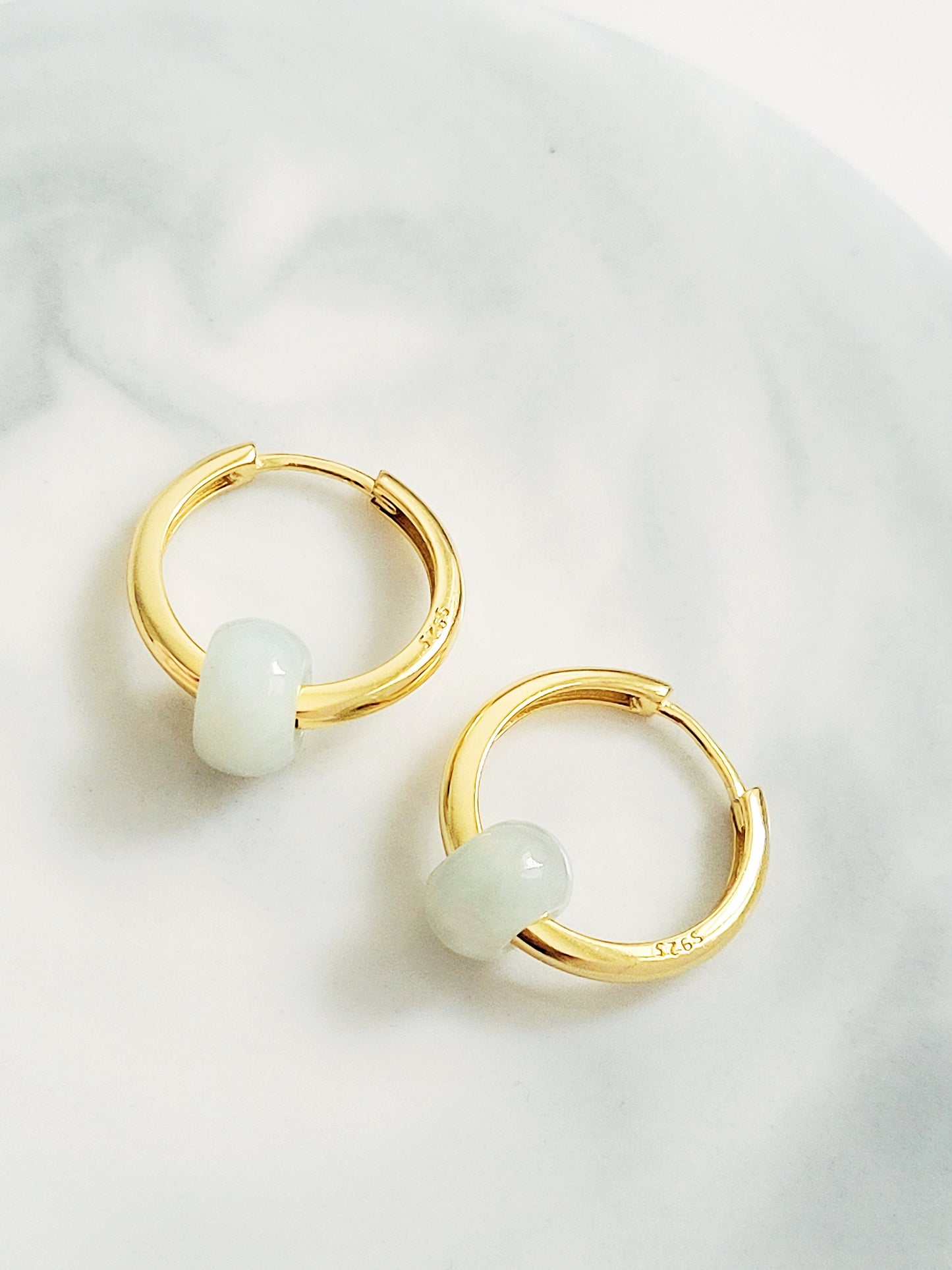 Beautiful gold hoop earrings crafted in 18ct gold plated over sterling silver with green jade stones, offering a stylish touch that enhances any jewelry collection.