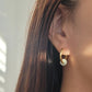 Elegant gold plated jade hoop earrings showcasing a rich green hue, perfect for adding a touch of sophistication to any outfit.
