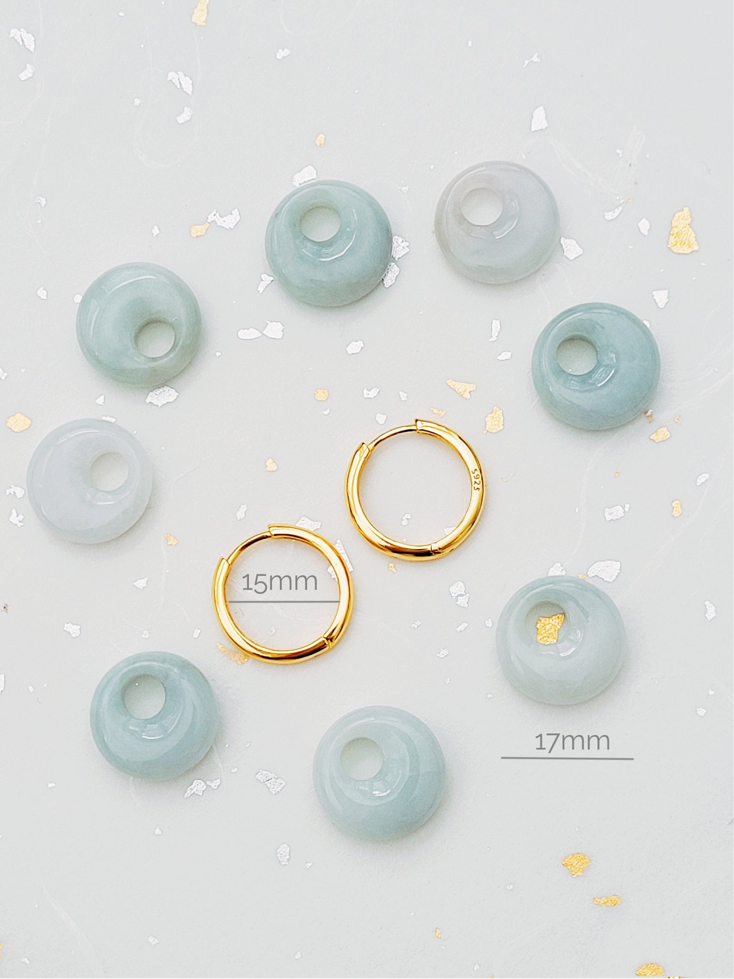 Minimalist jade and gold hoop earrings, combining timeless elegance with modern simplicity.