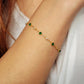 Model wearing a green gemstone bracelet in gold plated sterling silver, perfect jewellery gift for her.