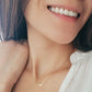 A girl wearing a gold bar necklace in gold plated sterling silver, best gift for her
