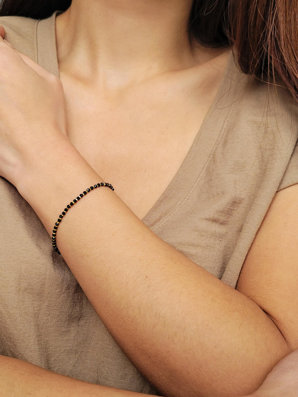 This dainty black onyx bracelet showcases tiny delicate black onyx gemstone beads, accented with 18k gold vermeil beads to blend geometric minimalism with natural beauty.