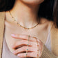 Close-up of a 22k gold vermeil choker necklace with black onyx beads worn around the neck. Crafted in 22k gold plated over sterling silver and natural gemstone. Perfect gift for mom.