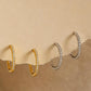 Set of  pavé diamond huggie hoop earrings featuring tiny crystals set in gold vermeil or sterling silver huggies. Minimalist and versatile jewellery for everyday.