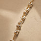 Close up of the organic shaped sterling silver nuggets on a gold chain, dainty mixed metal bracelet.