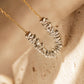 Close-up of irregular sterling silver beads on a fine gold chain, showing the sculptural shapes and polished mixed-metal finish.