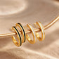 A set of thin enamel gold ear cuff earrings, one pair in black enamel and one pair in white enamel, crafted in 18k gold vermeil.