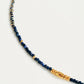 A delicate Lapis Lazuli beaded necklace featuring deep blue 2mm faceted gemstones and accented with 18k gold vermeil beads, styled as a minimalist choker necklace, perfect for gifting on birthdays, anniversaries, or special occasions.