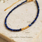 A deep blue lapis lazuli gemstone and gold bead bracelet featuring faceted natural stone beads and gold-plated accents.