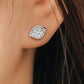 Close-up of a model wearing a dainty organic leaf-shaped stud earring in 925 sterling silver, featuring a cluster of shimmering pave CZ diamonds
