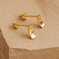 A pair of tiny gold stud earrings in curved bar shape crafted in gold plated sterling silver, dainty and minimal style.