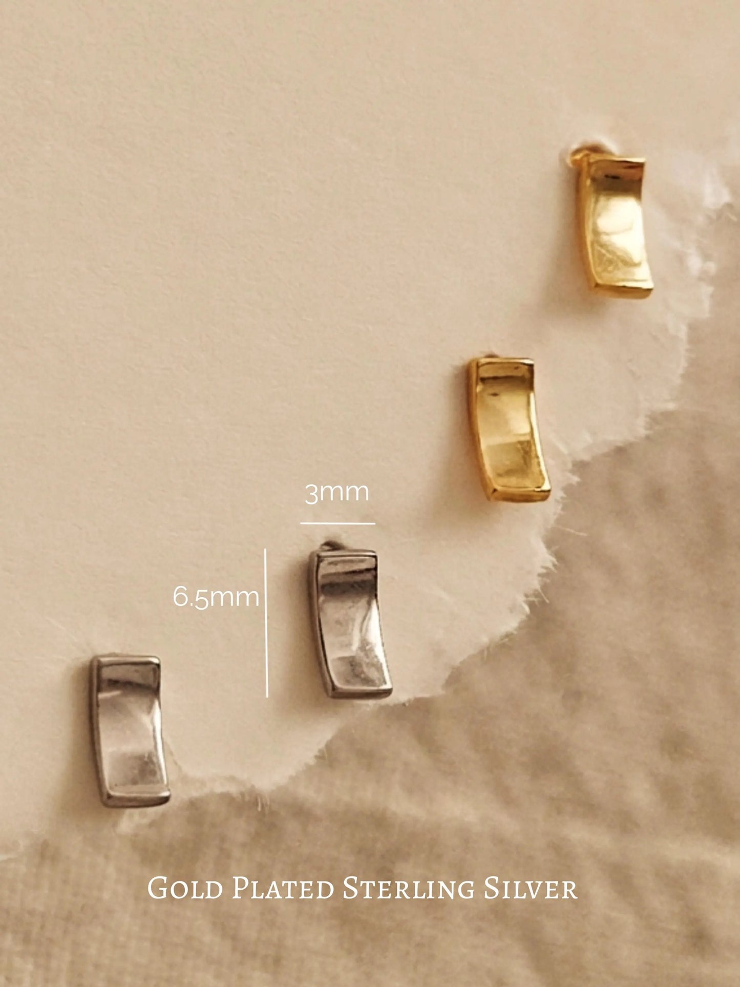 Gold and silver bar stud earrings, minimalist rectangle stud earrings in gold vermeil and sterling silver on an aesthetic beige color stone