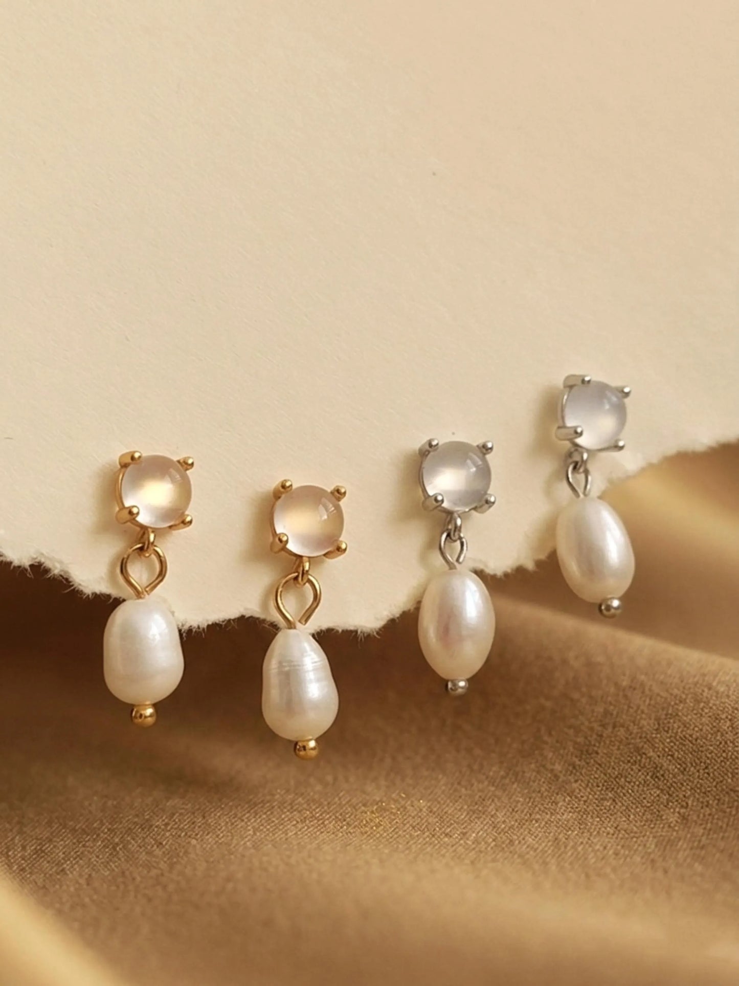 Set of Moonstone stud pearl drop earrings in gold vermeil and silver dainty bridal earrings on a beige background