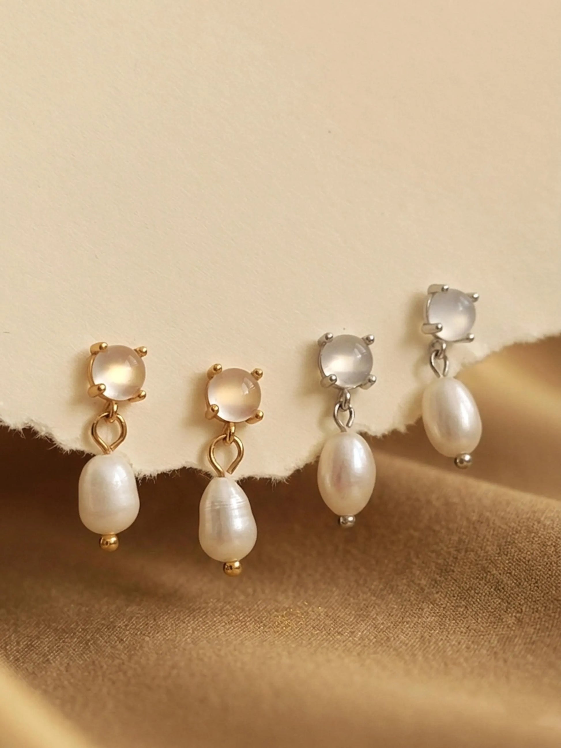 Set of Moonstone stud pearl drop earrings in gold vermeil and silver dainty bridal earrings on a beige background