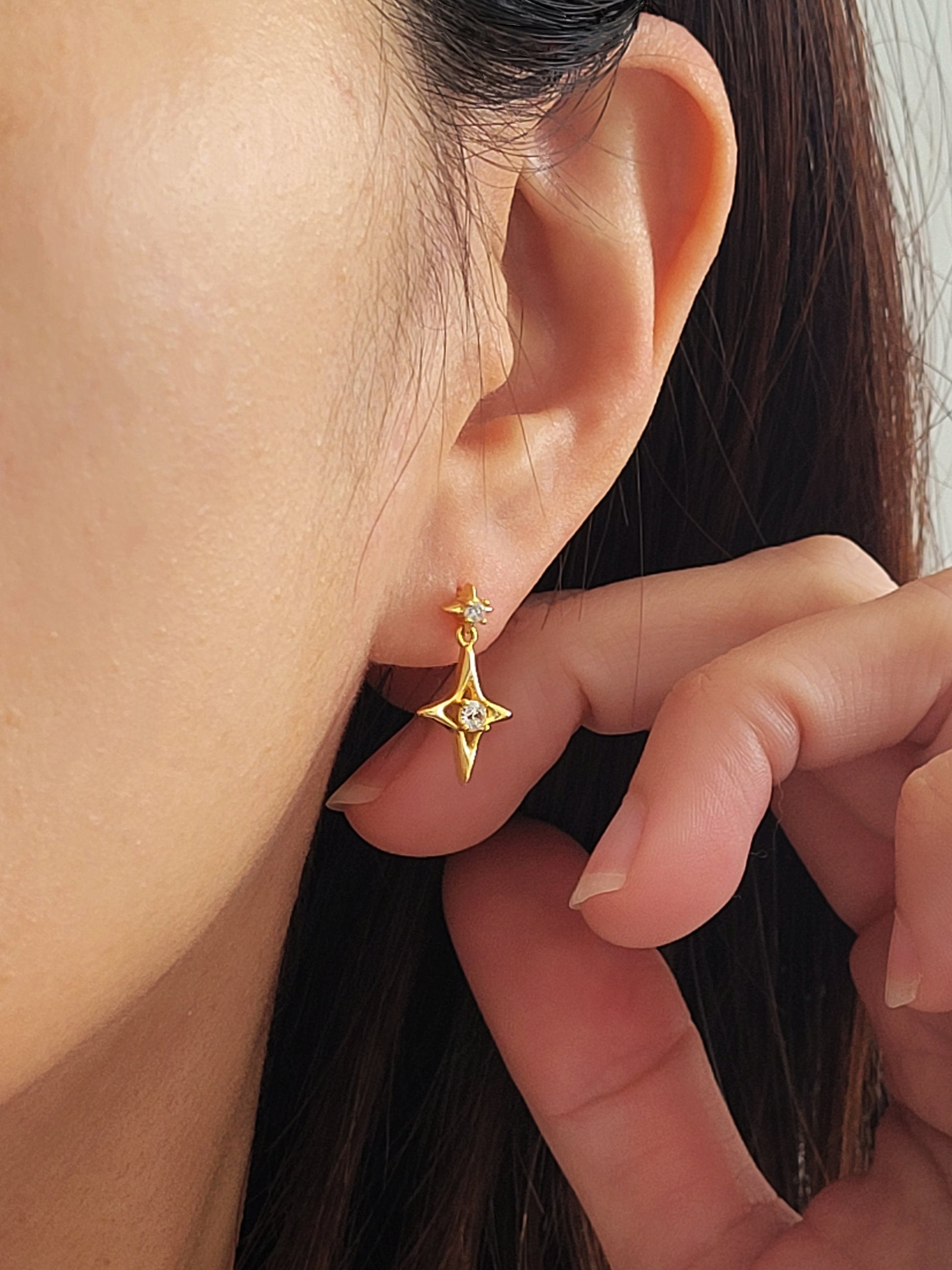 Dainty celestial inspired starburst earrings with a delicate gold-plated finish, perfect for everyday wear or as a thoughtful gift for her or astrology lovers.