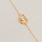 Exquisite 18ct gold-plated sweet pretzel bracelet adorned with a sparkling diamond, embodying elegance and luxury.