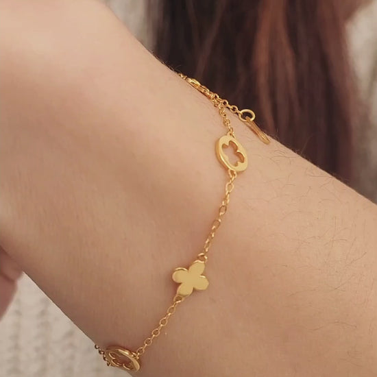 A dainty gold bracelet featuring van cleef clover motif, crafted in gold plated sterling silver.