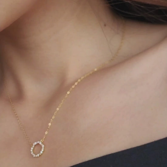 Model wearing Gold Vermeil Infinity Circle Necklace, showcasing its minimalist design.